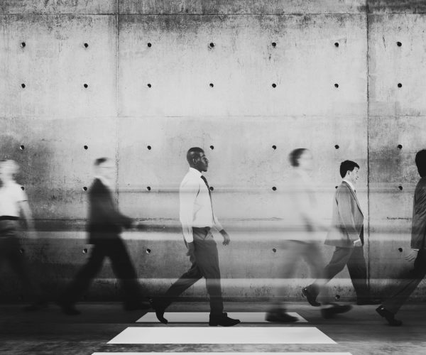 Diverse business people commuting underground